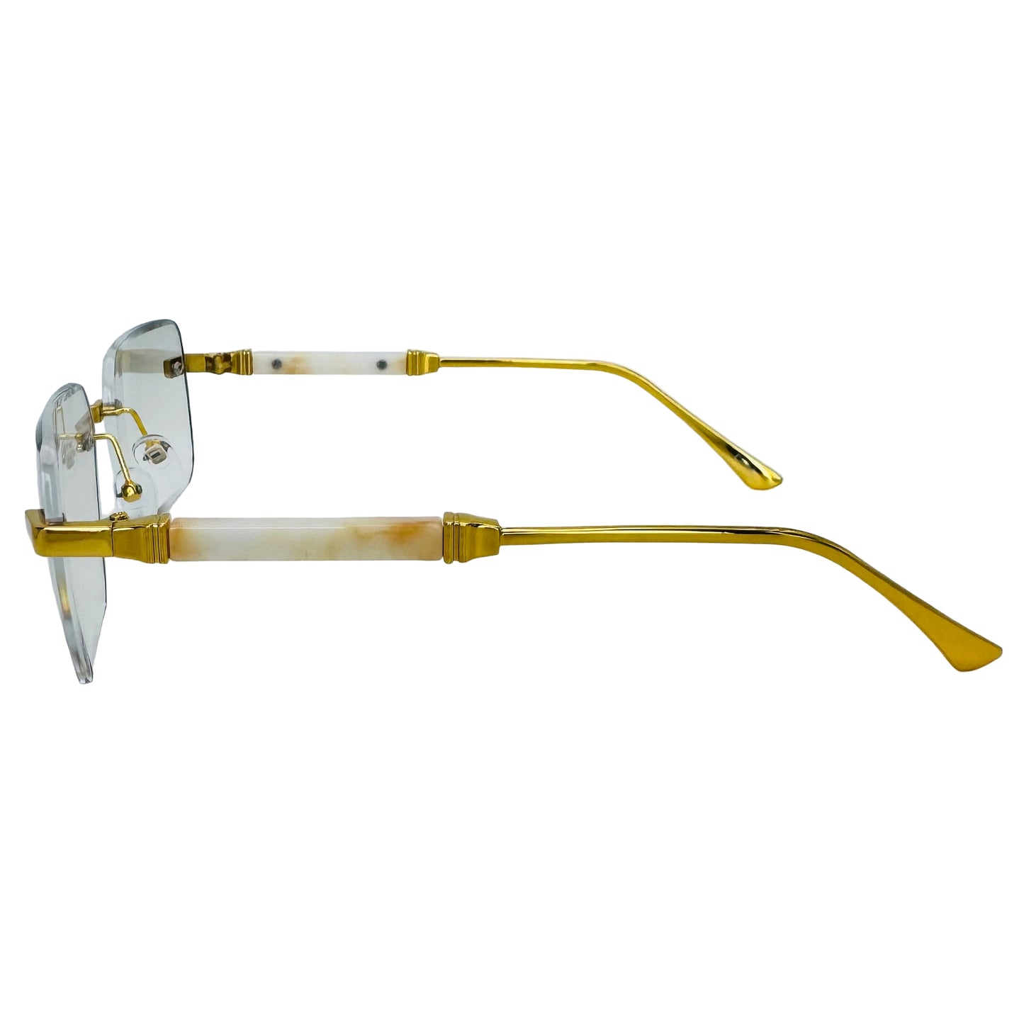 Gold-framed eyeglasses on a light gray background