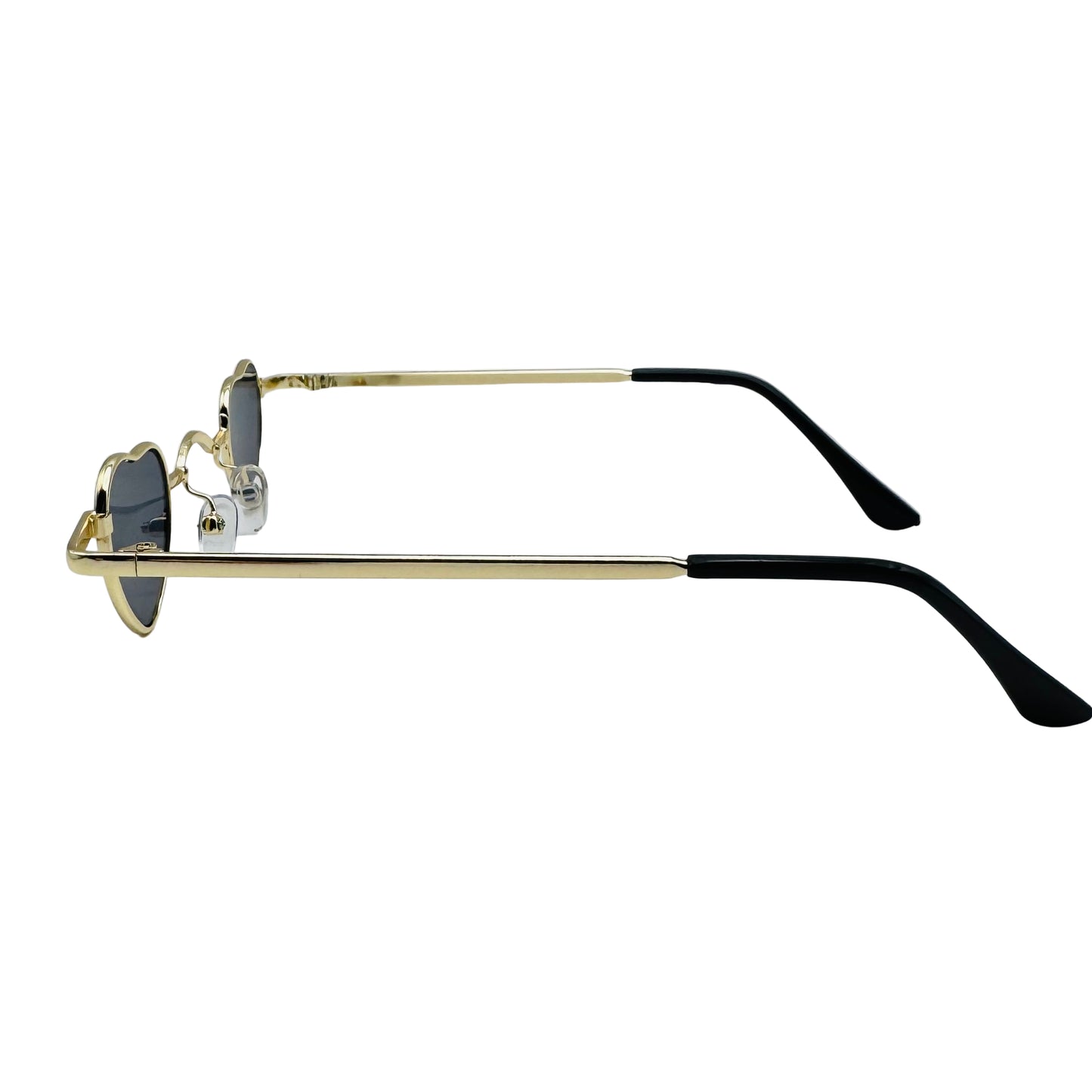 Sunglasses with gold frame and black arms on a light gray background