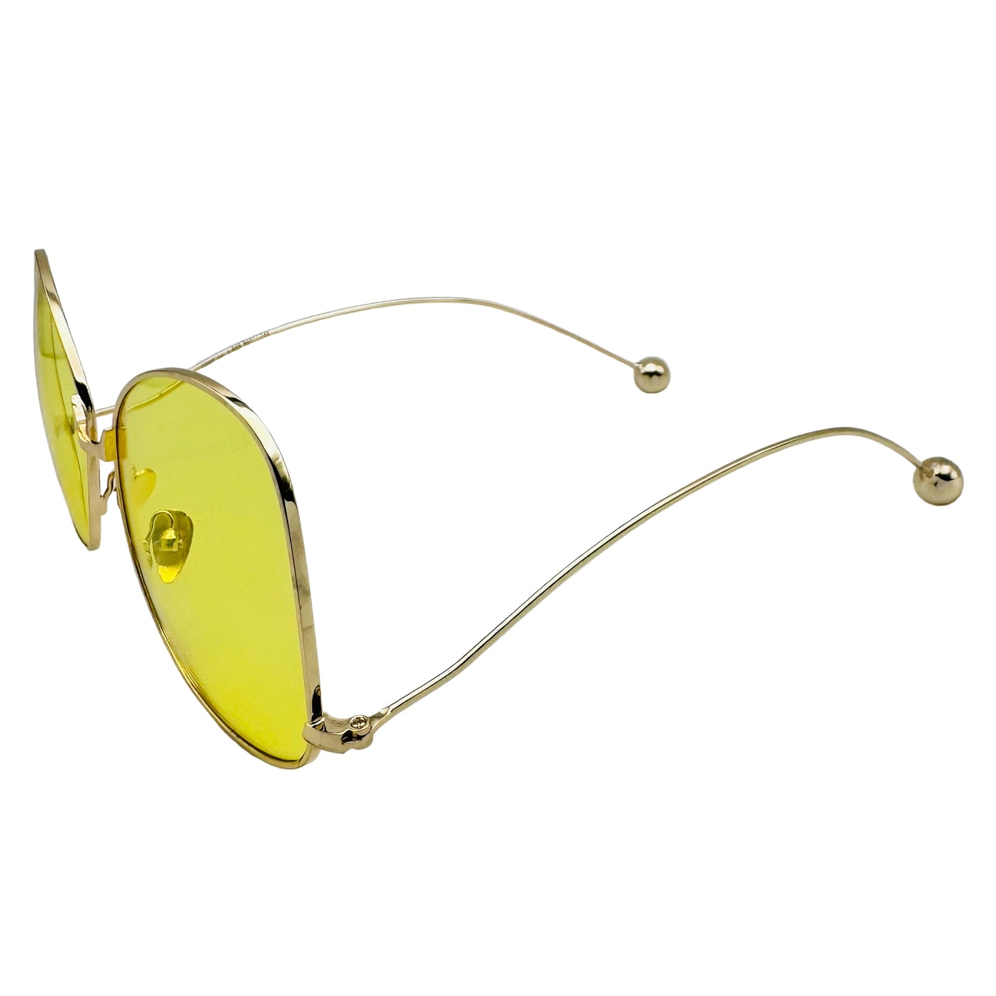 Gold-framed sunglasses with yellow lenses on a white background