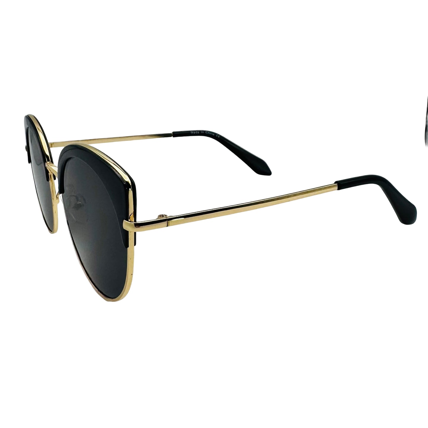 Sunglasses with gold frame and black lenses on a white background