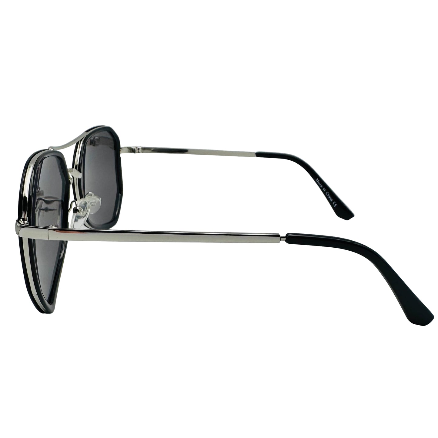 Sunglasses with black lenses and black frames on a light gray background