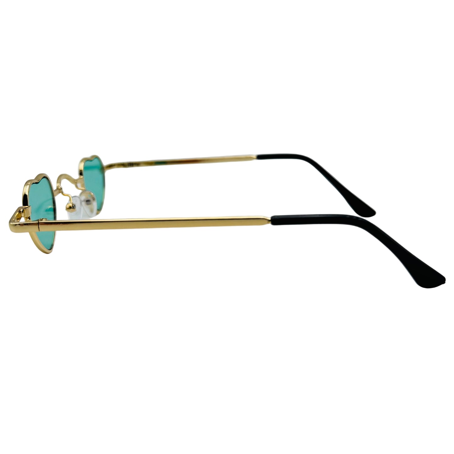 Sunglasses with gold frame and black arms on a light gray background