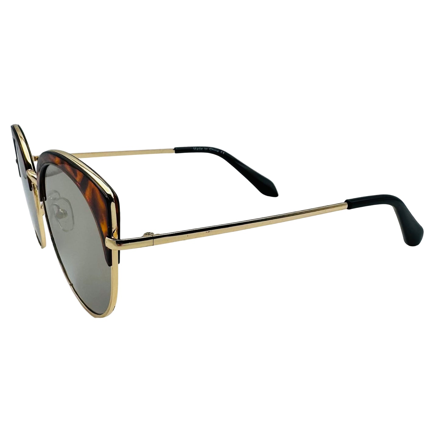Sunglasses with gold frame and black arms on a white background