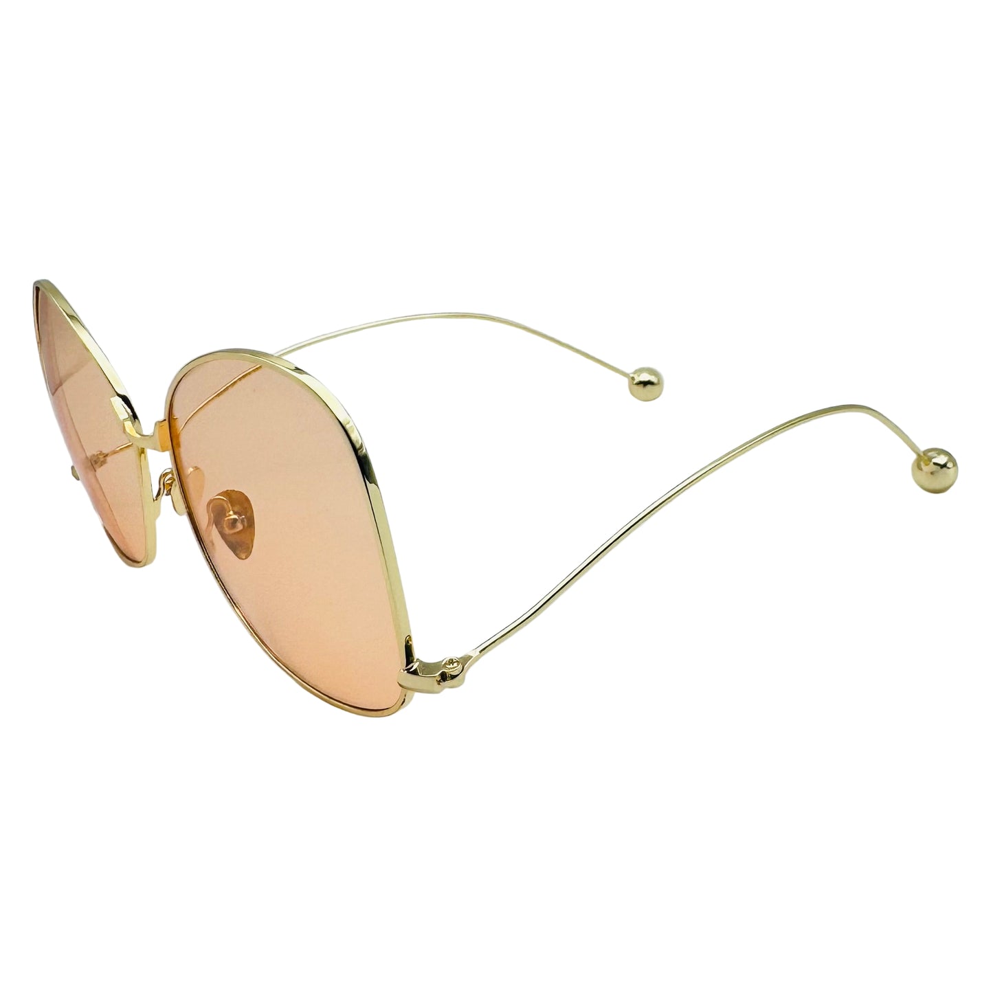 Gold-framed sunglasses with pink lenses on a white background