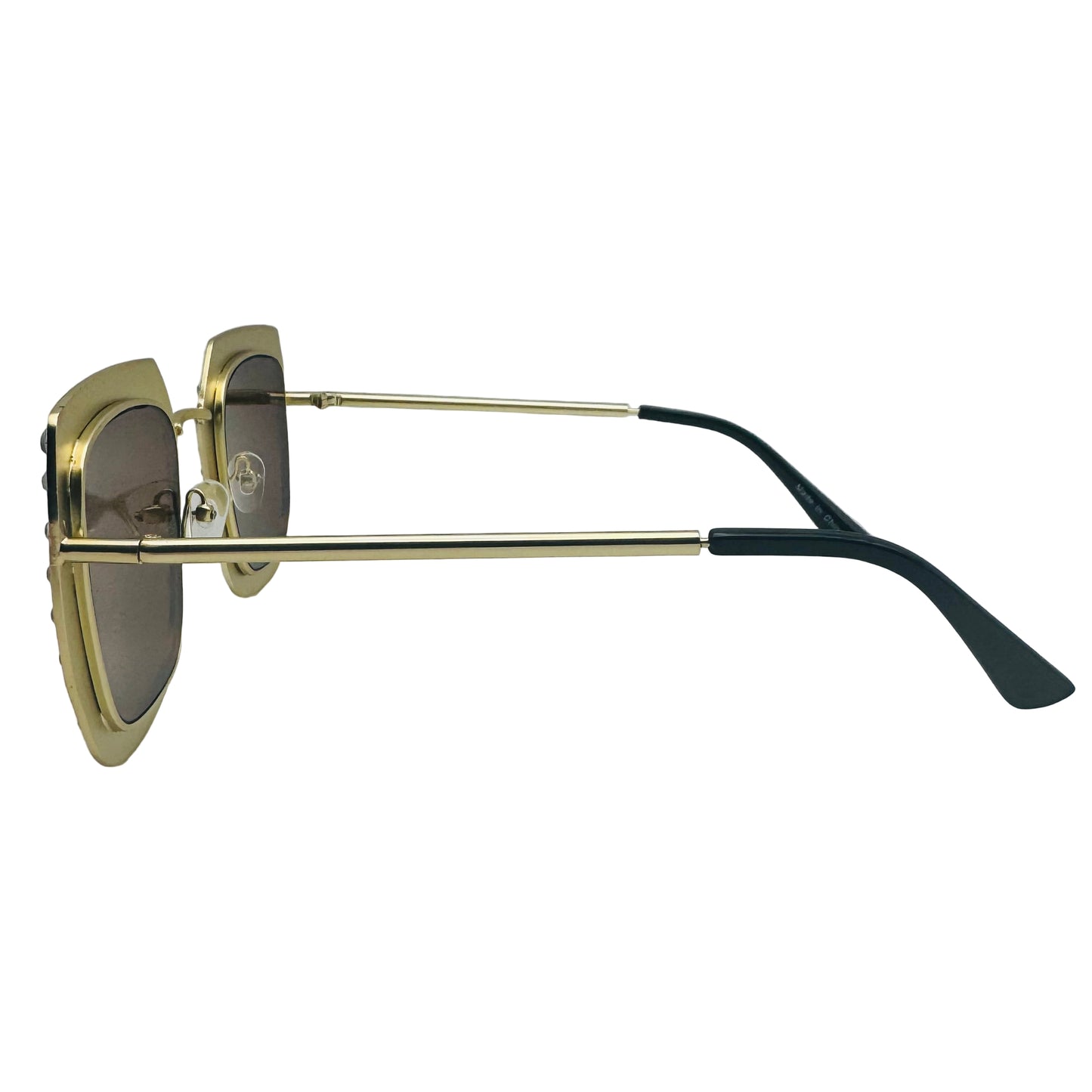 Gold-framed sunglasses with black arms on a light gray background
