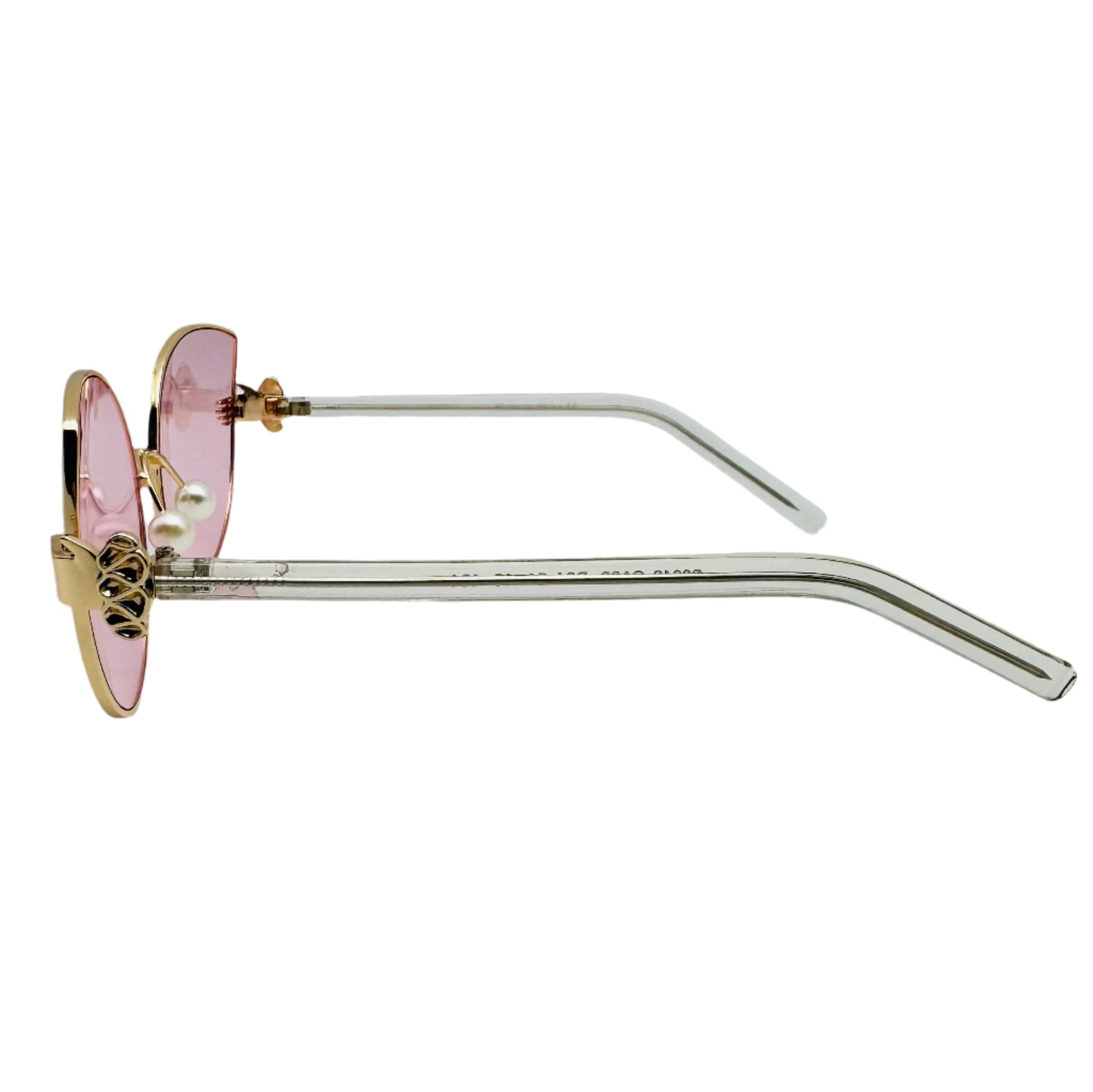 Sunglasses with pink lenses and gold frames on a white background