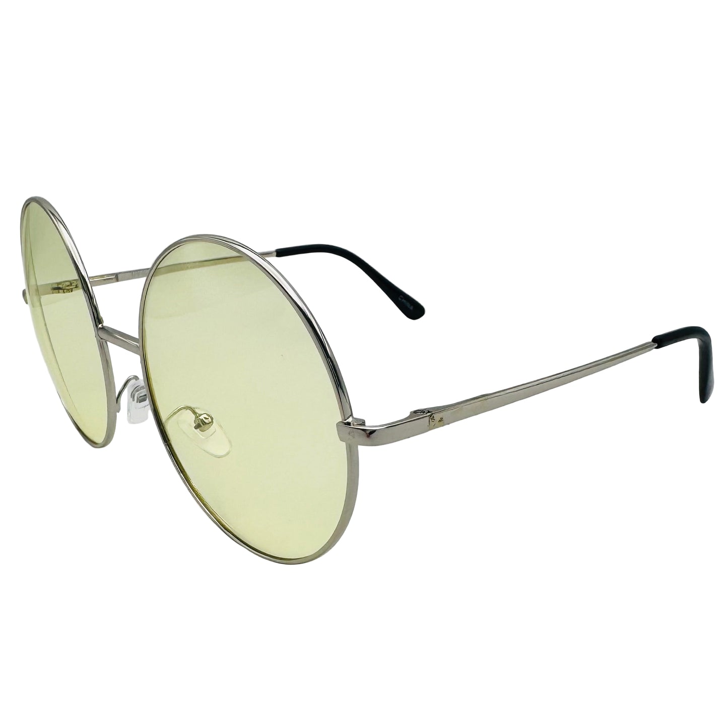 Round sunglasses with gold frame and yellow-tinted lenses on a light gray background
