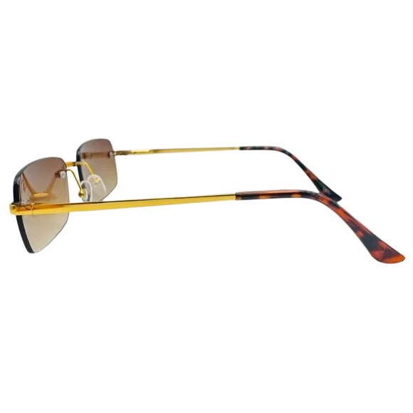 Sunglasses with gold frame and tortoiseshell arms on a white background