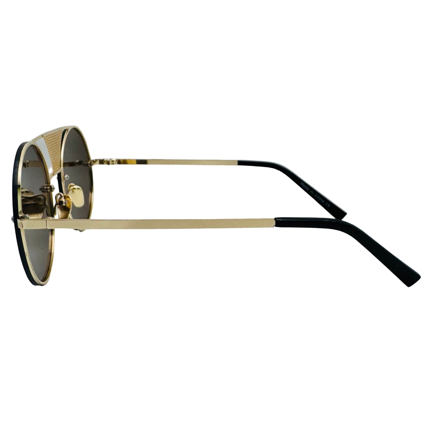 Sunglasses with gold frame and black arms on a light gray background