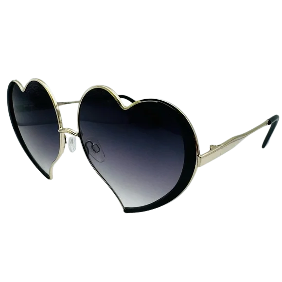 Heart-shaped sunglasses with black lenses and gold frames on a white background