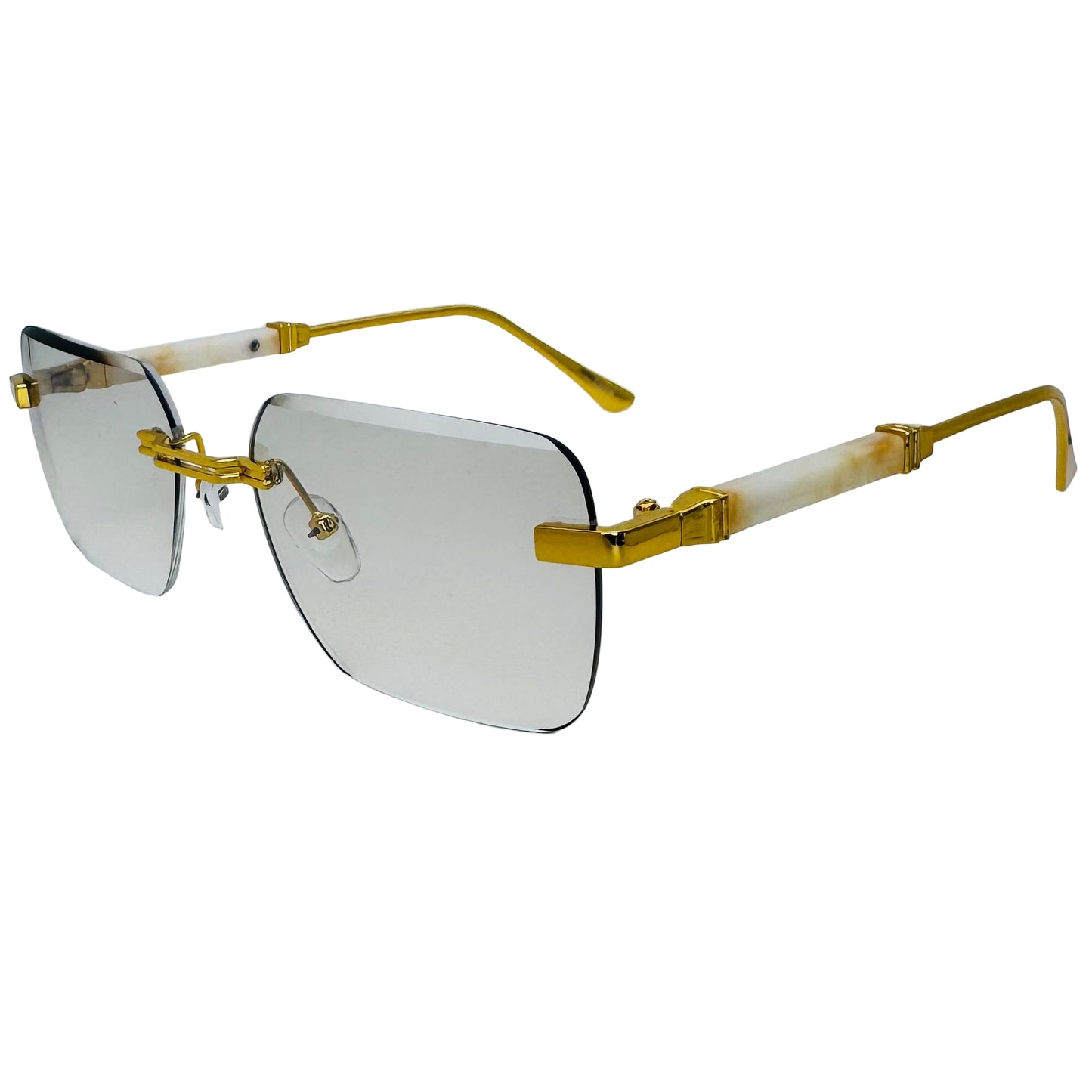 Gold-rimmed sunglasses on a light gray background
