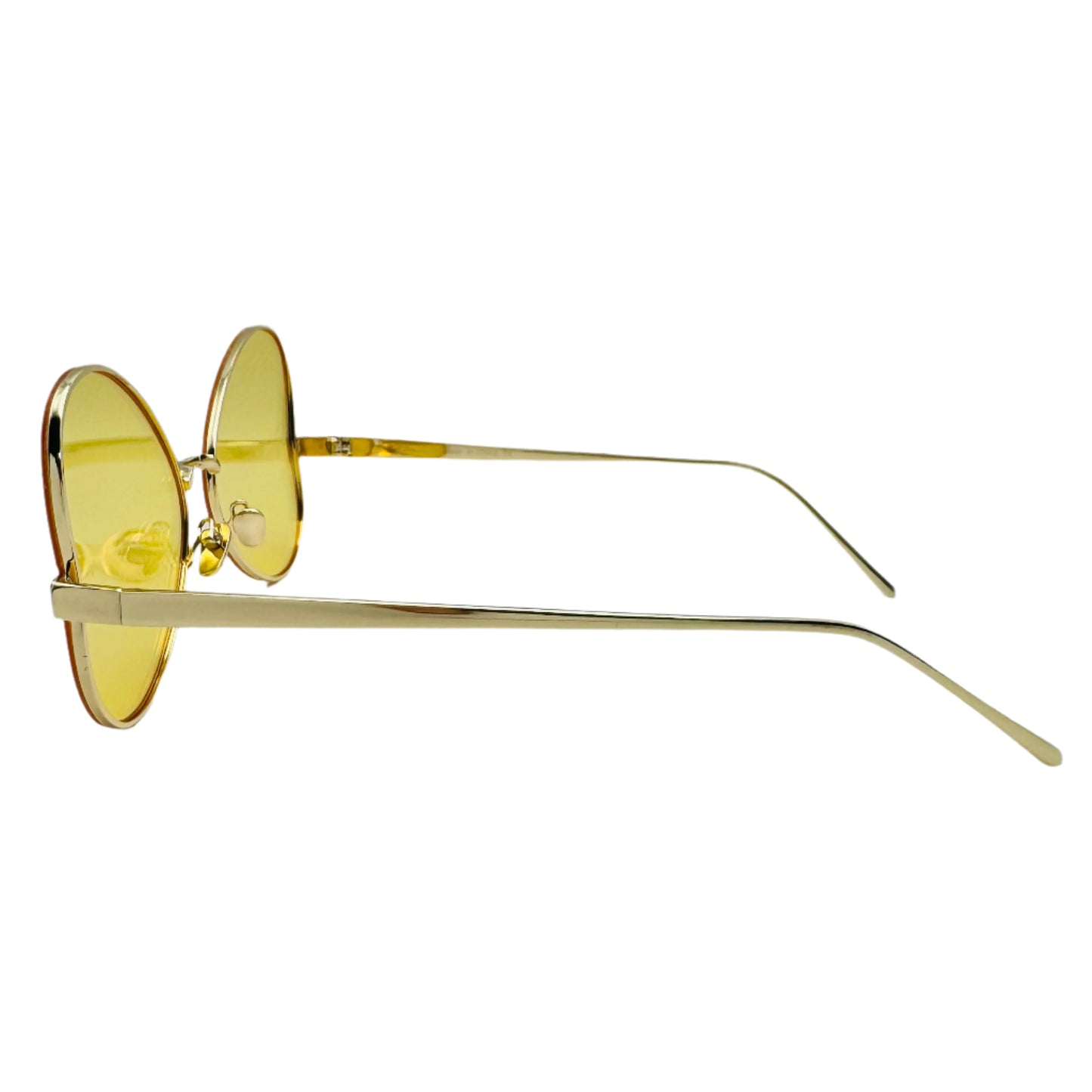 Gold-framed sunglasses with yellow lenses on a white background