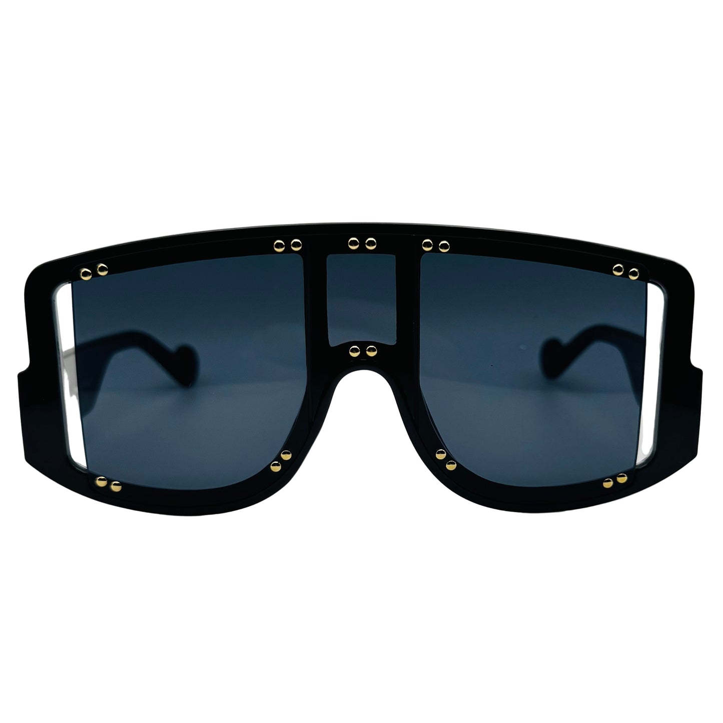 Black sunglasses with gold accents on a light gray background