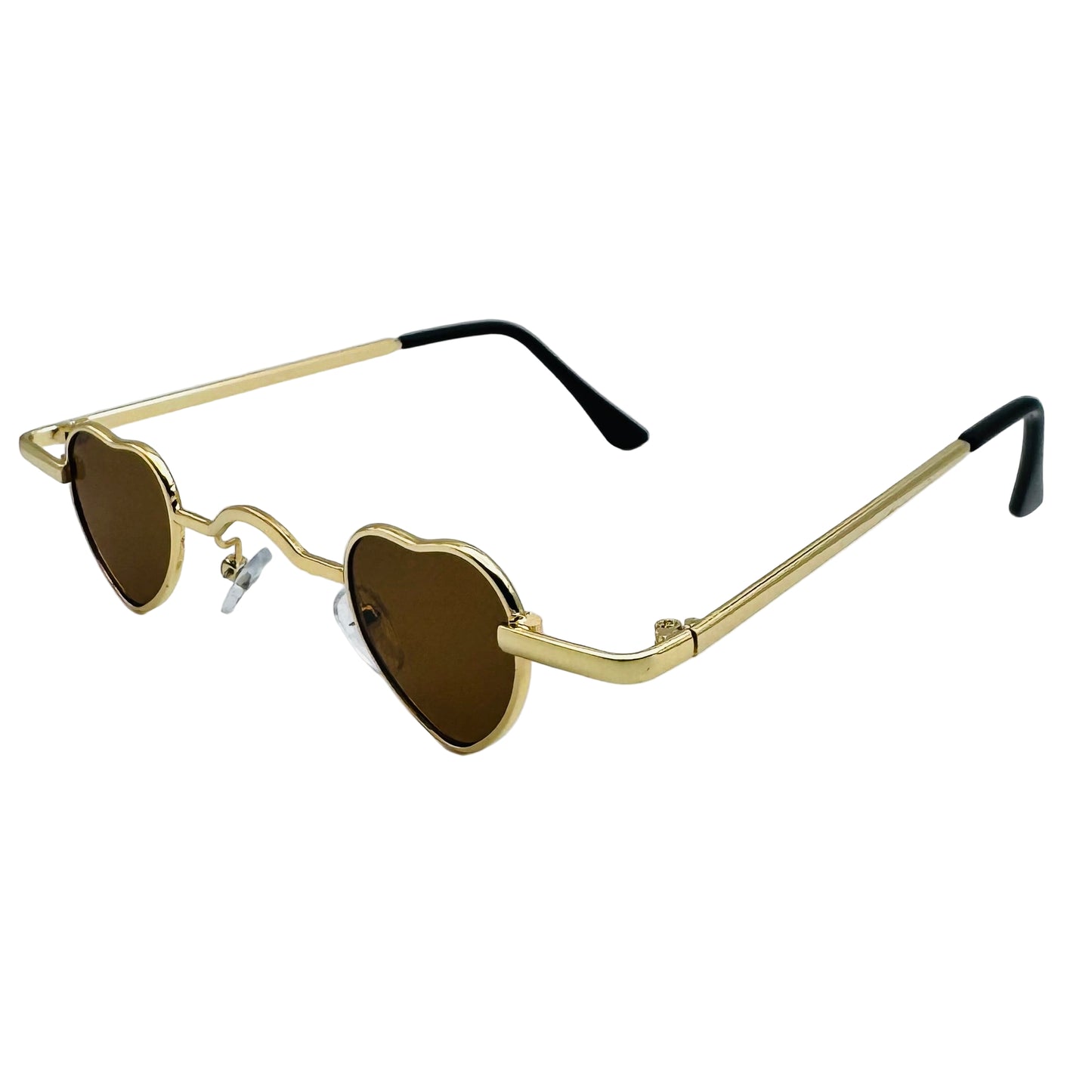 Heart-shaped sunglasses with gold frames and brown lenses on a light gray background