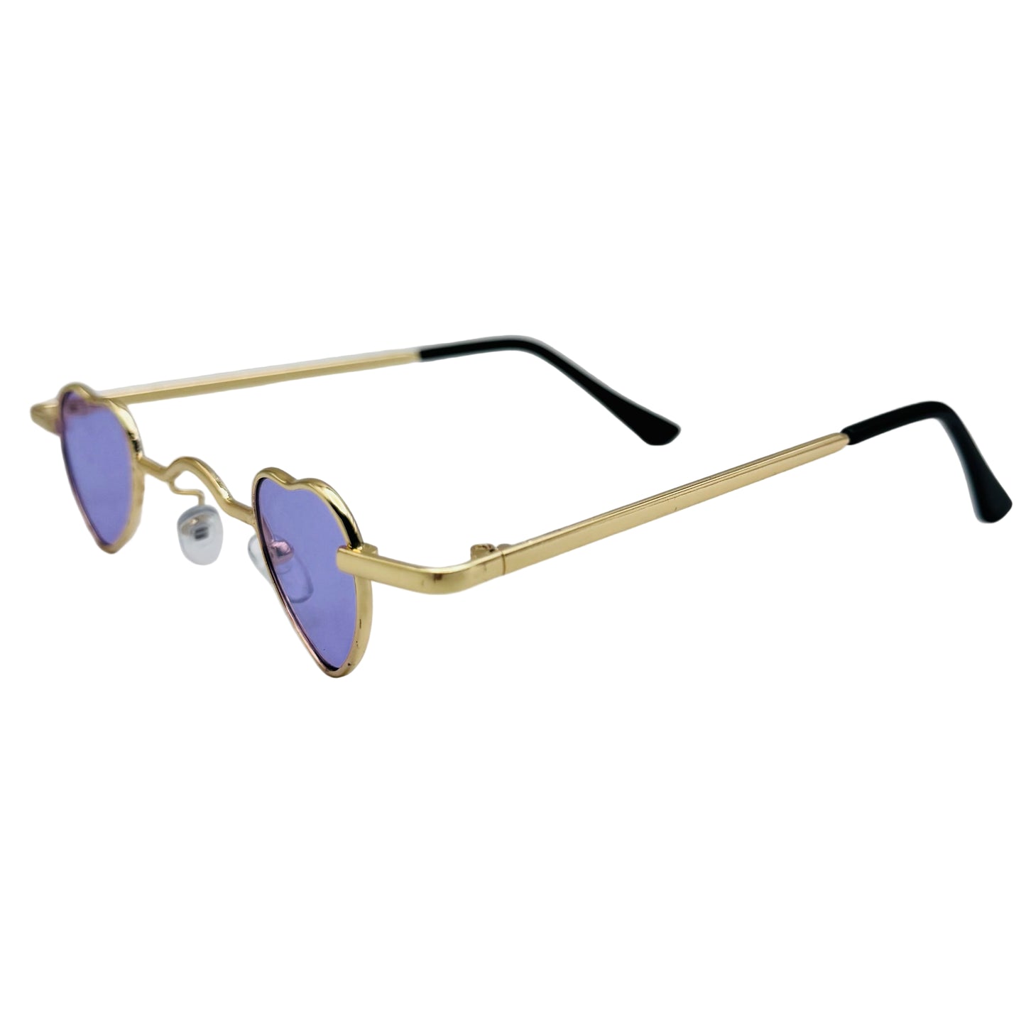 Heart-shaped sunglasses with gold frame and purple lenses on a light gray background