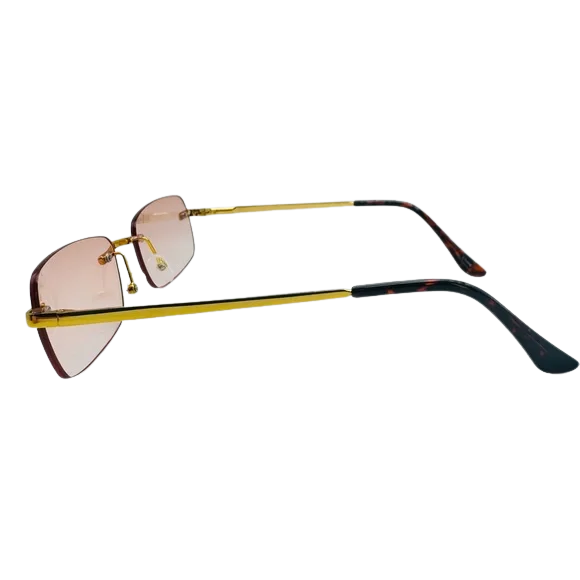 Sunglasses with gold frame and pink lenses on a white background