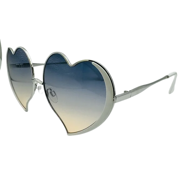 Heart-shaped sunglasses with gradient lenses on a white background