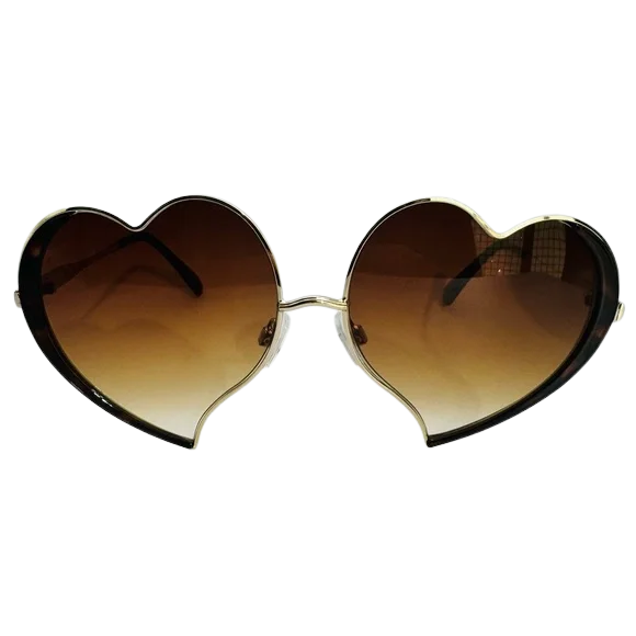 Heart-shaped sunglasses with brown gradient lenses on a white background