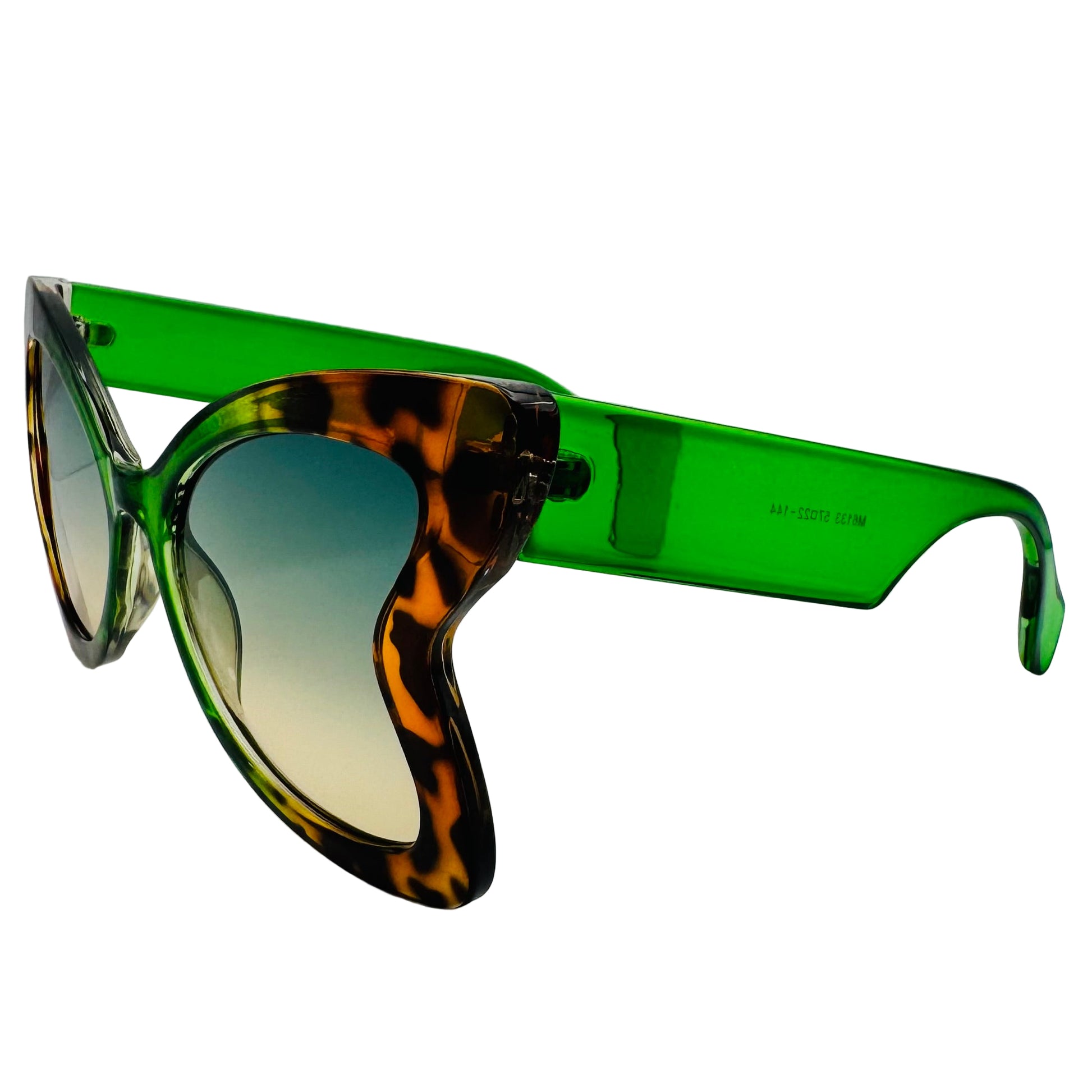 Sunglasses with green frame and tortoiseshell arms on a white background