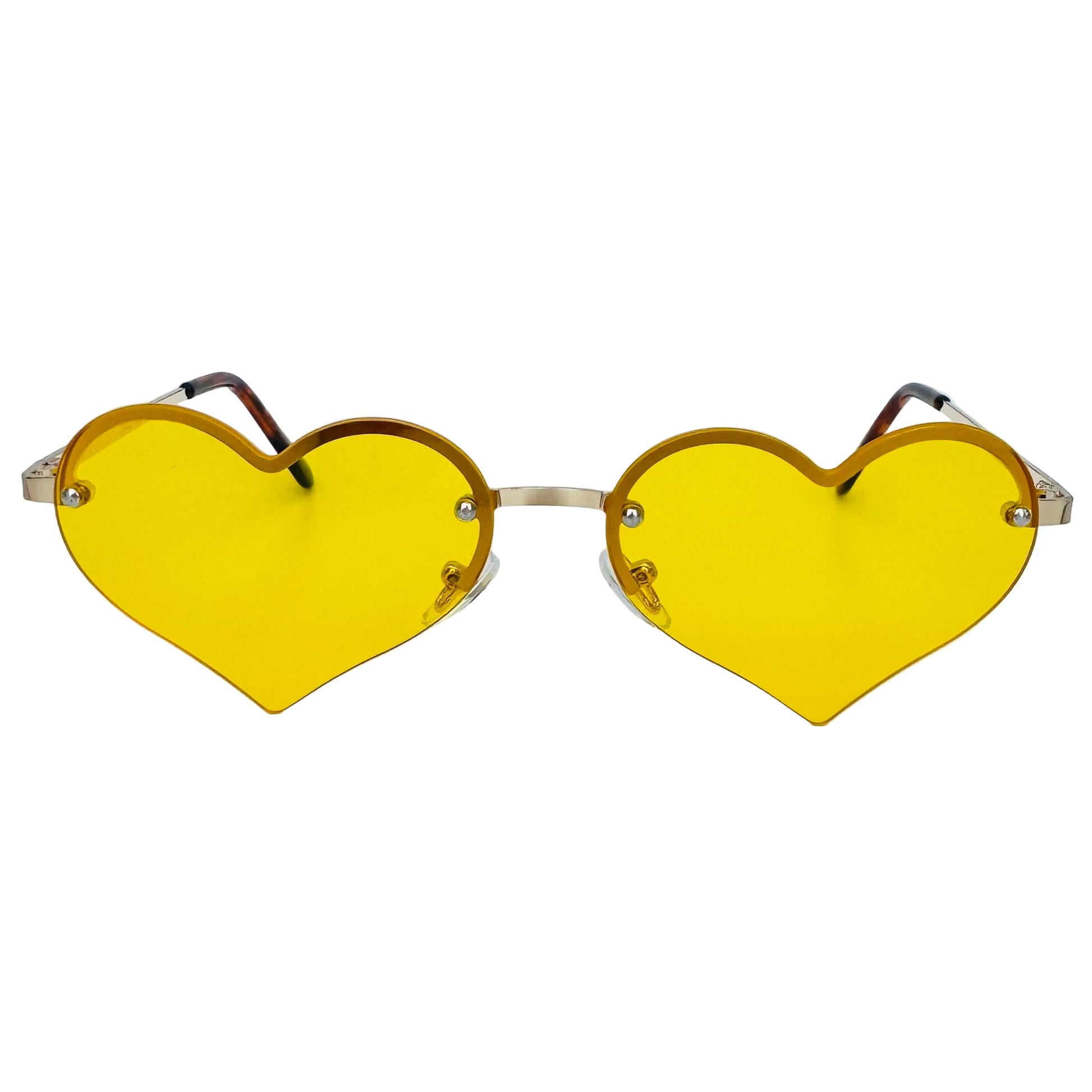 Heart-shaped sunglasses with yellow lenses on a light gray background