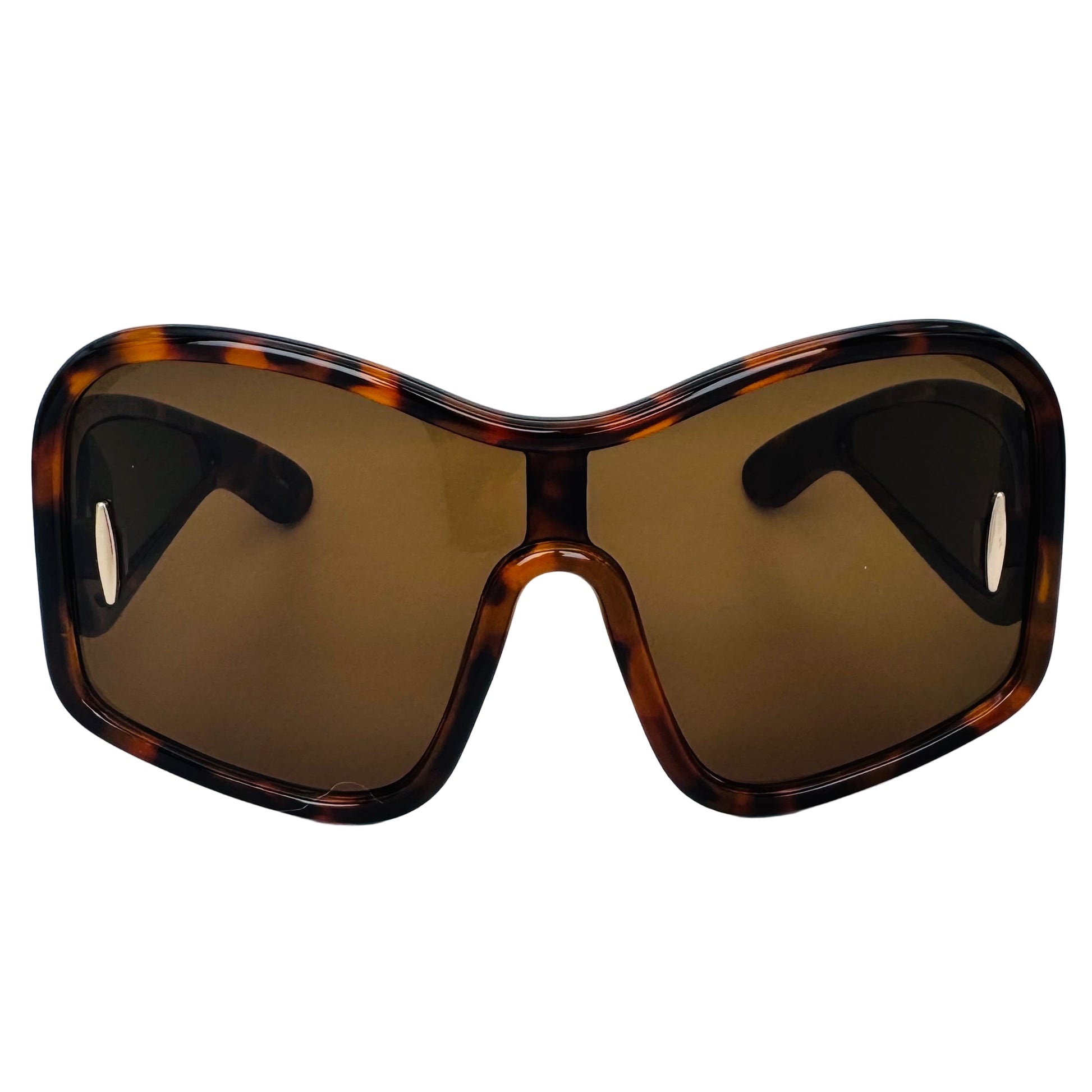 Sunglasses with tortoiseshell frame and brown lenses on a light gray background