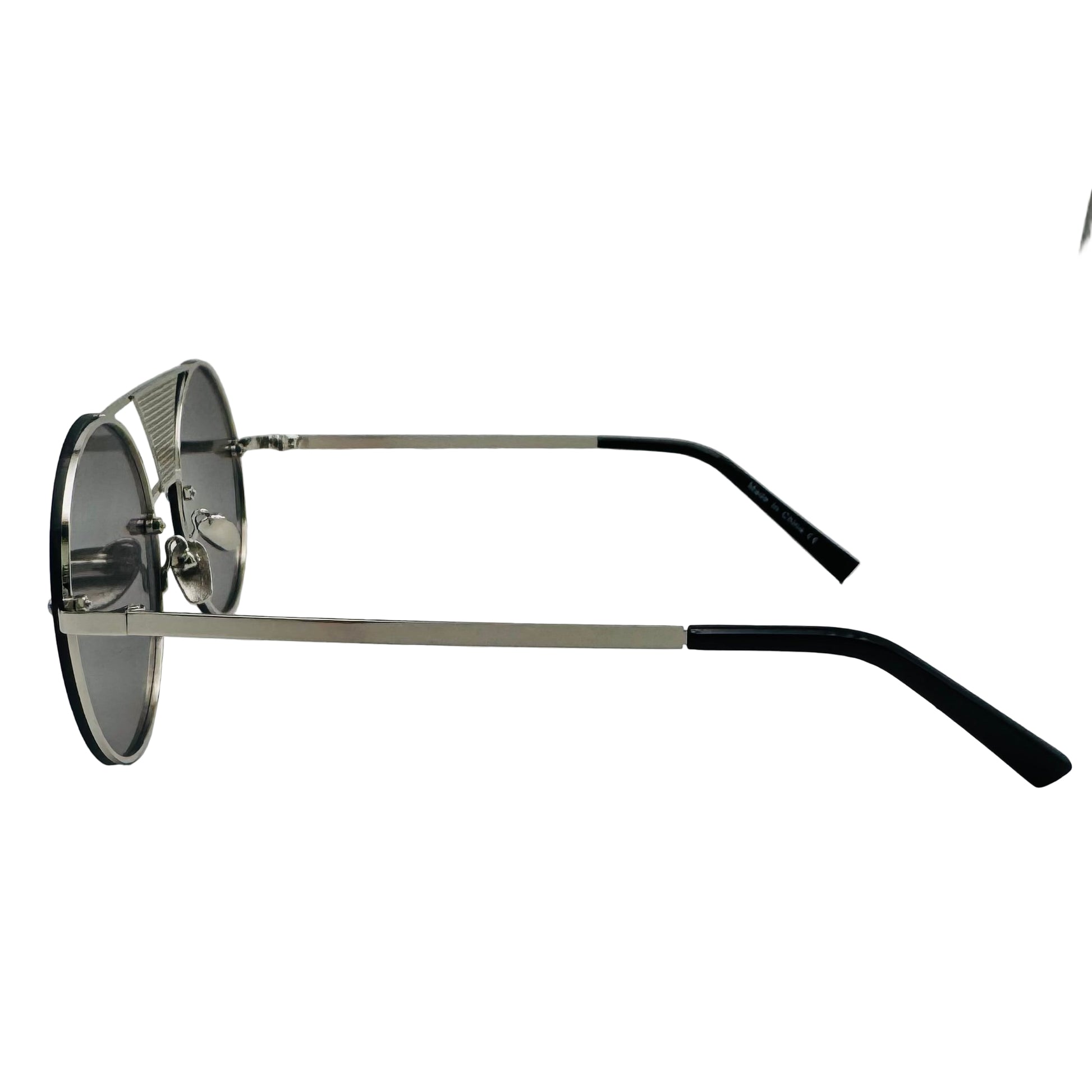 Sunglasses with black and silver frame on a light gray background