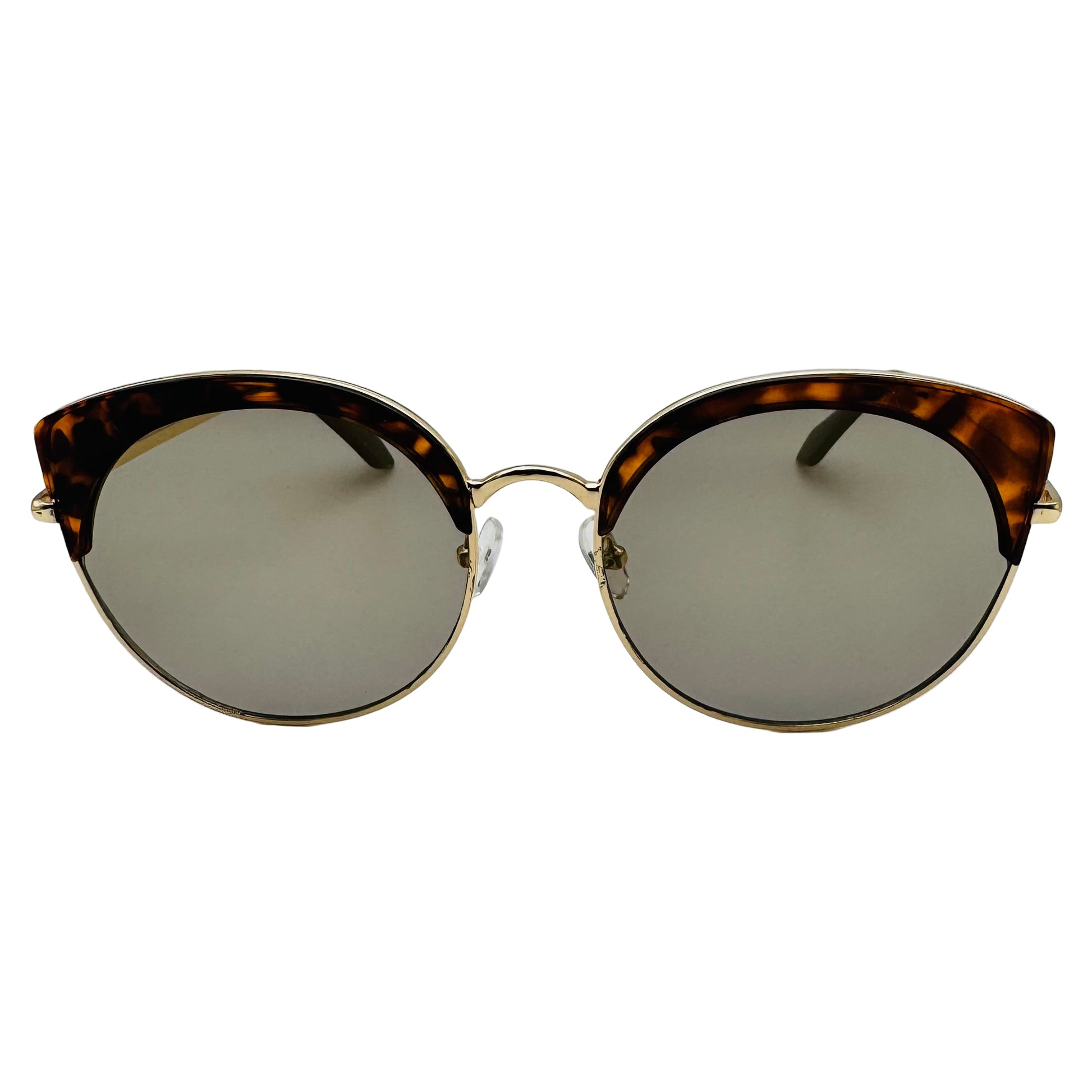 Sunglasses with tortoiseshell frame and reflective lenses on a white background