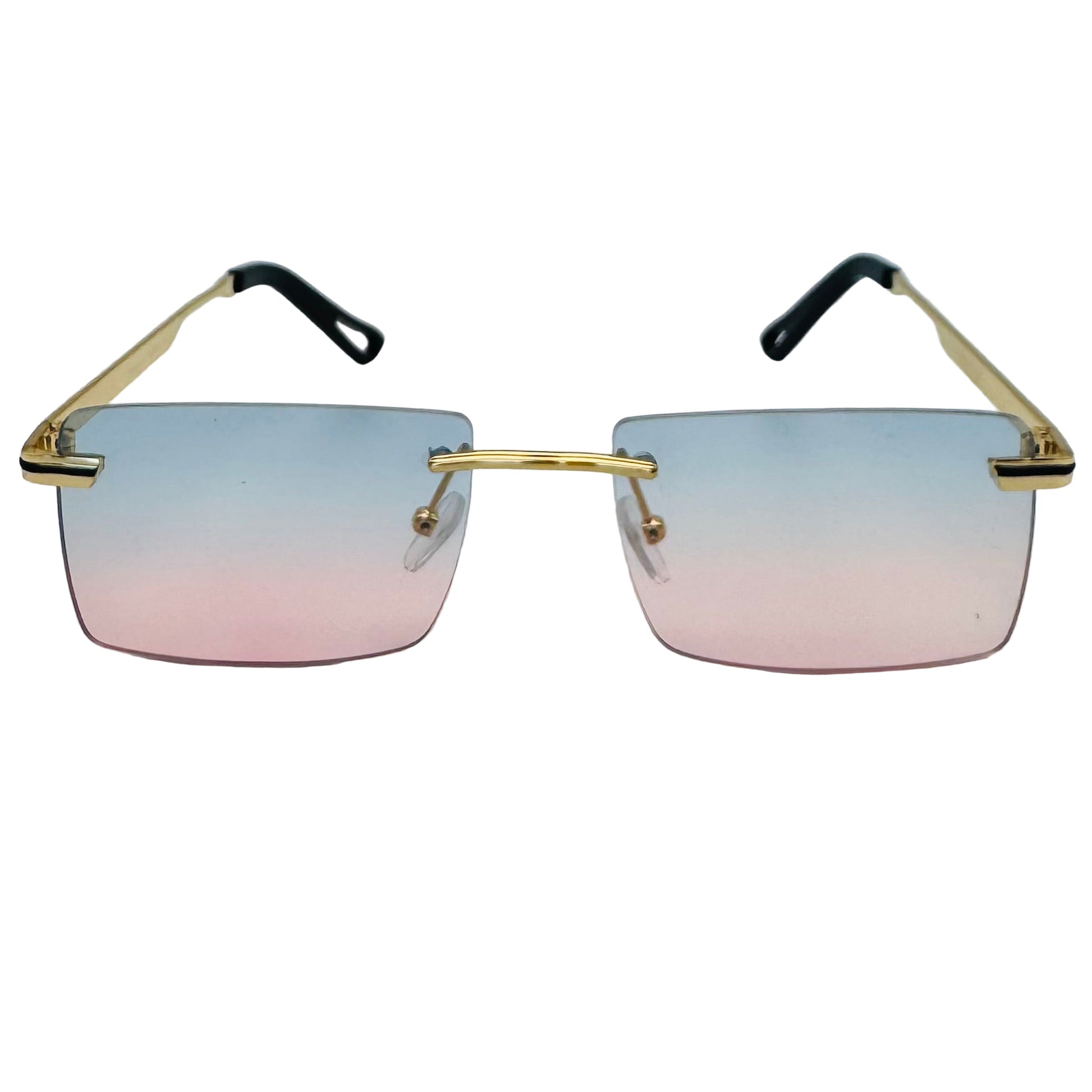 Sunglasses with gradient lenses and gold frames on a light gray background
