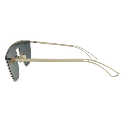 Gold-framed sunglasses with dark lenses on a light gray background