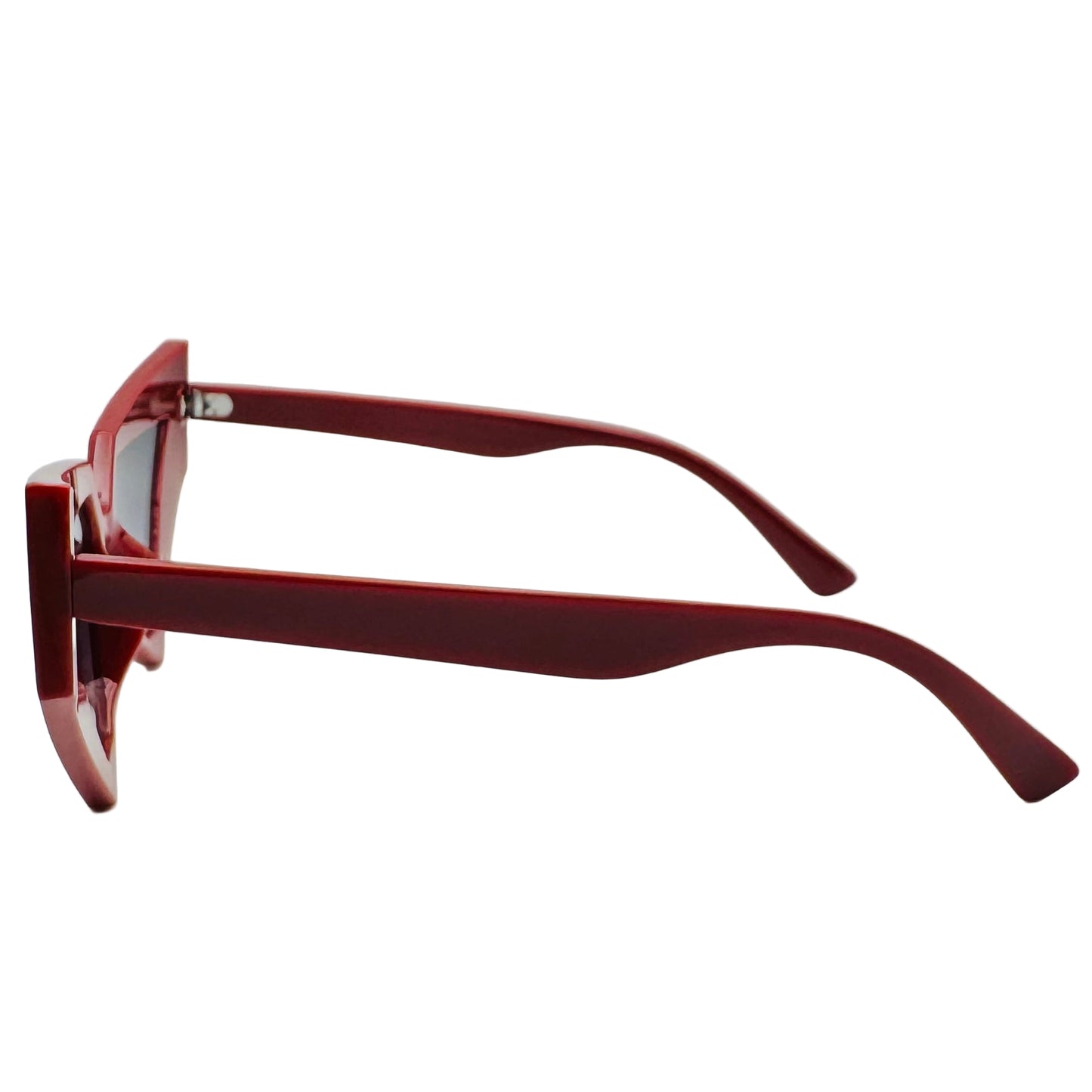 Red sunglasses on a white surface