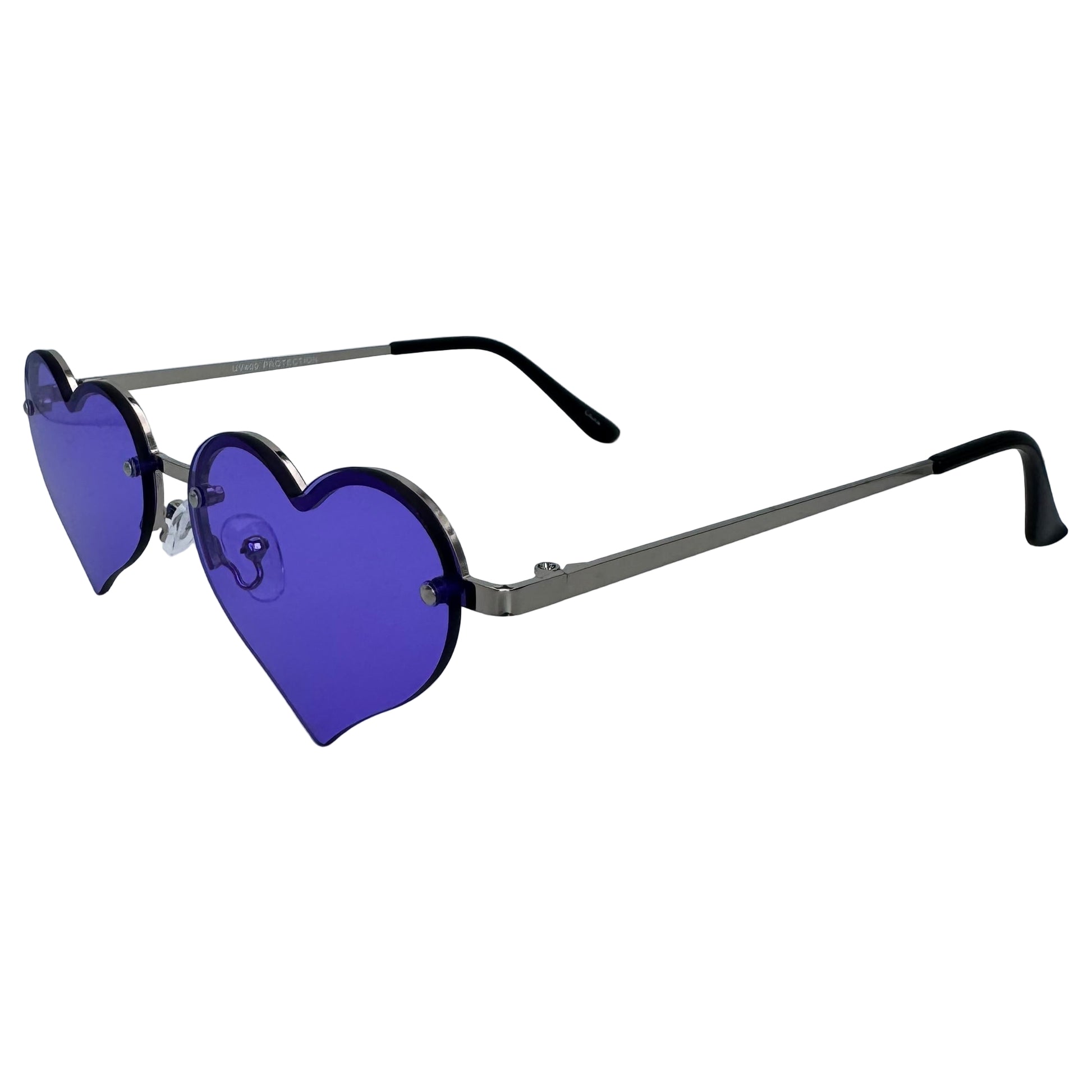 Heart-shaped sunglasses with purple lenses on a light gray background