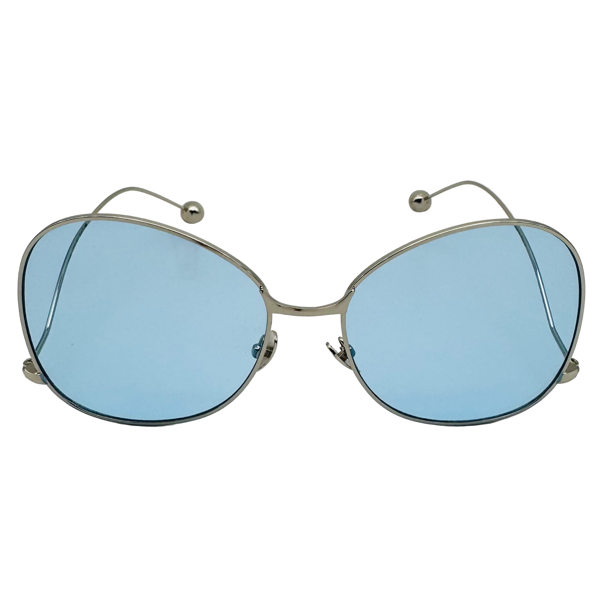 Sunglasses with blue lenses and silver frames on a white background