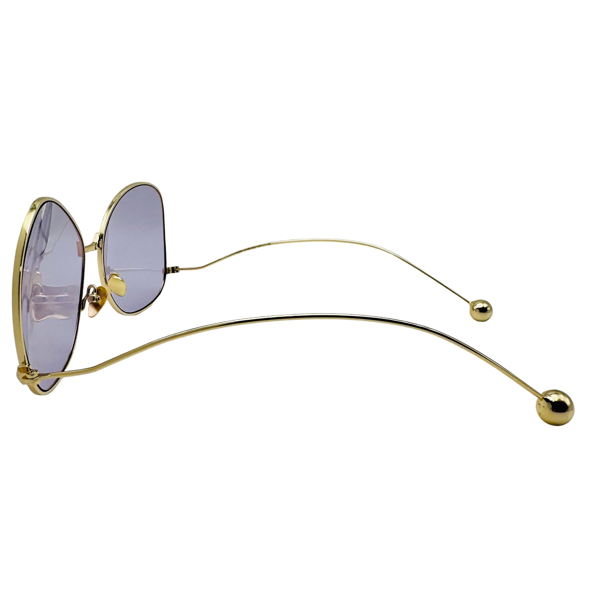 Gold-framed sunglasses with purple lenses on a white background