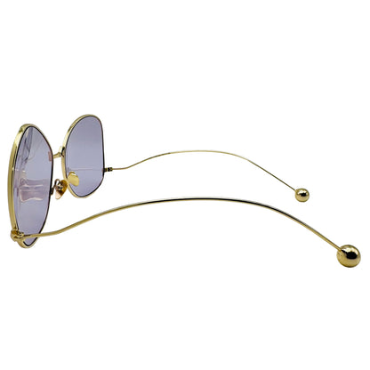 Gold-framed sunglasses with purple lenses on a white background