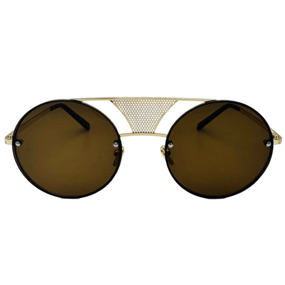 Sunglasses with gold frame and dark lenses on a light gray background