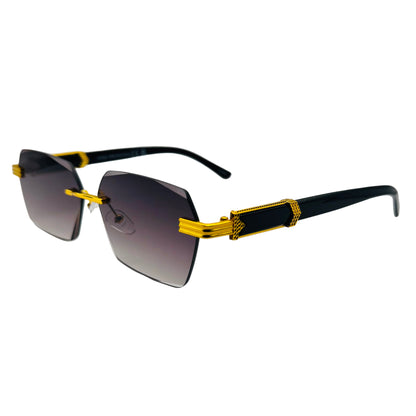 Sunglasses with gold and black frame on a light gray background