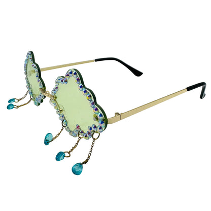 Decorative sunglasses with gemstone embellishments on a light gray background