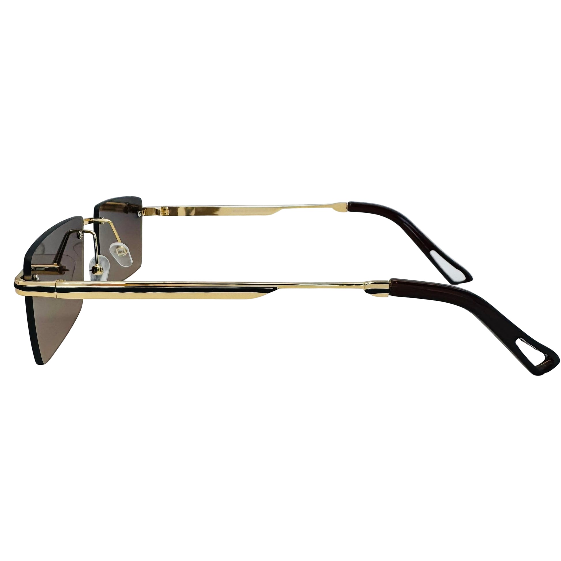 Sunglasses with gold frame and black arms on a light gray background