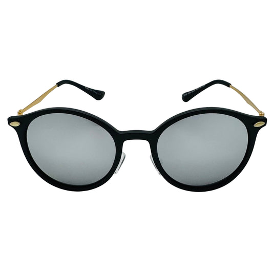 Black sunglasses with gold accents on a light gray background