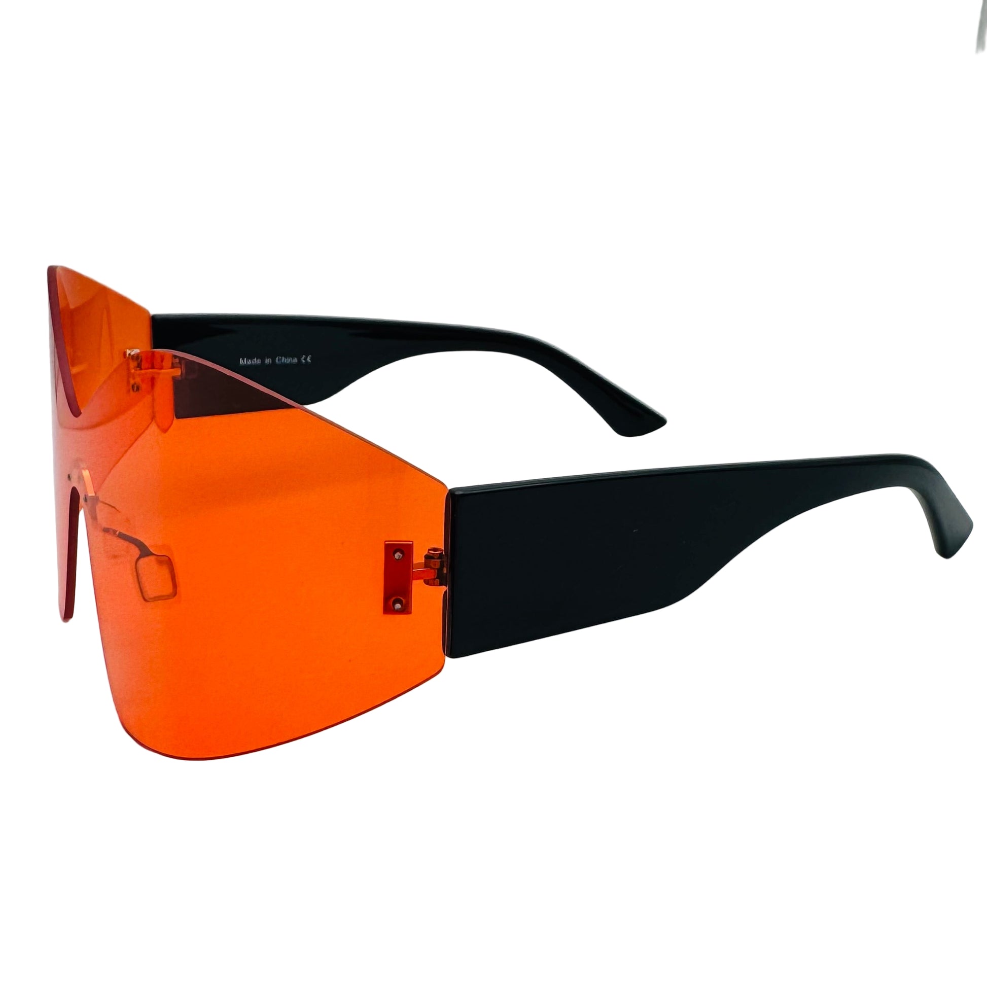 Sunglasses with orange lenses and black frames on a white background