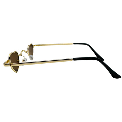 Gold and black sunglasses on a light gray background