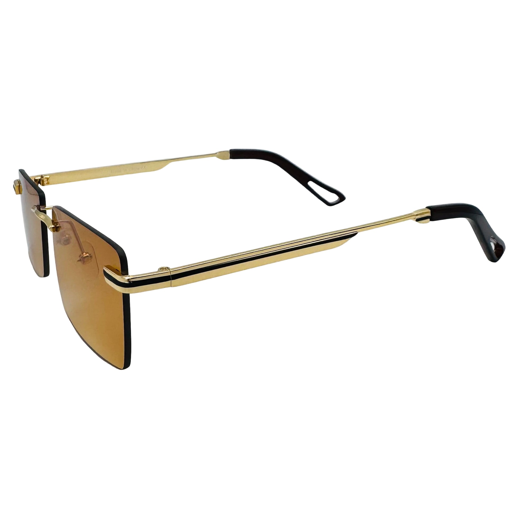 Gold-framed sunglasses with black arms on a light gray background