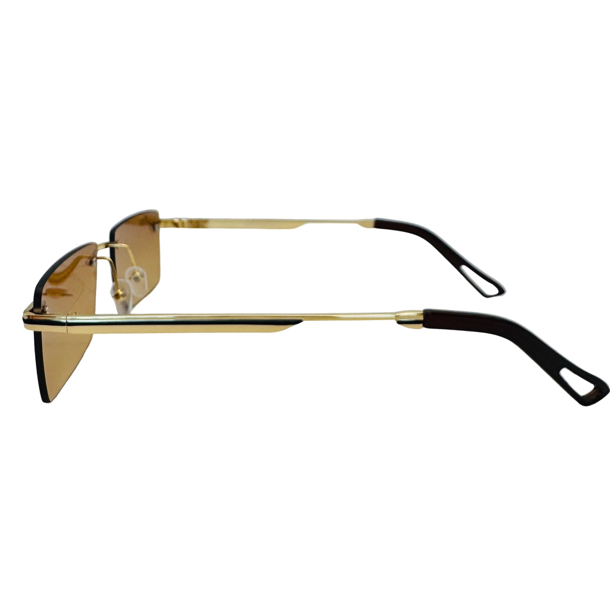Gold-framed sunglasses with black arms on a light gray background