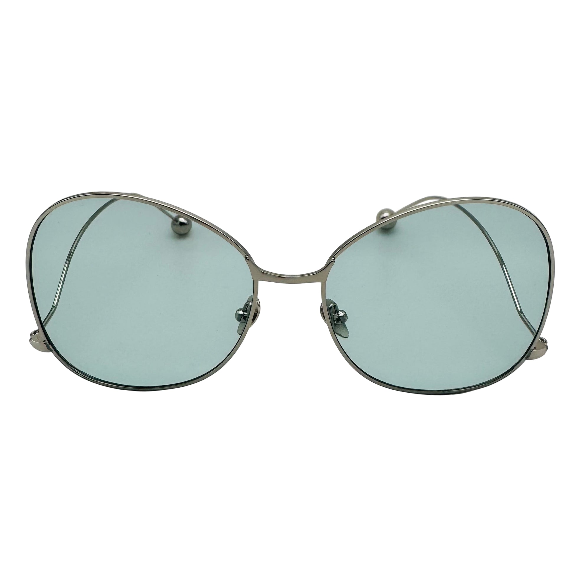 Round sunglasses with silver frame and light blue lenses on a white background