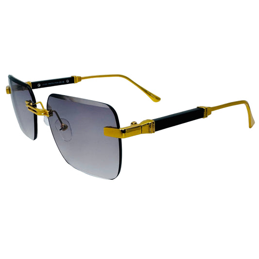 Sunglasses with gold and black frame on a light gray background