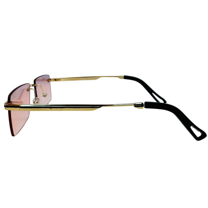Sunglasses with gold frame and black arms on a light gray background
