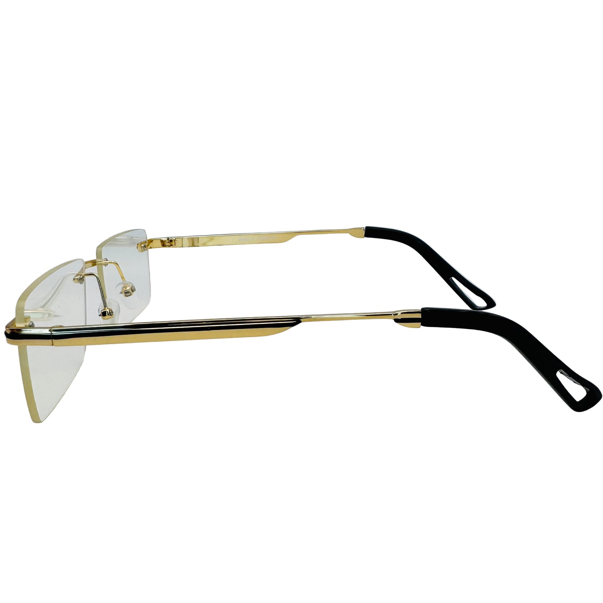Gold-framed glasses with black arms on a white background