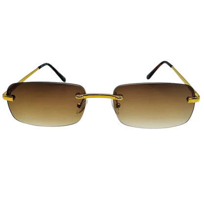 Sunglasses with gold frames and brown gradient lenses on a white background