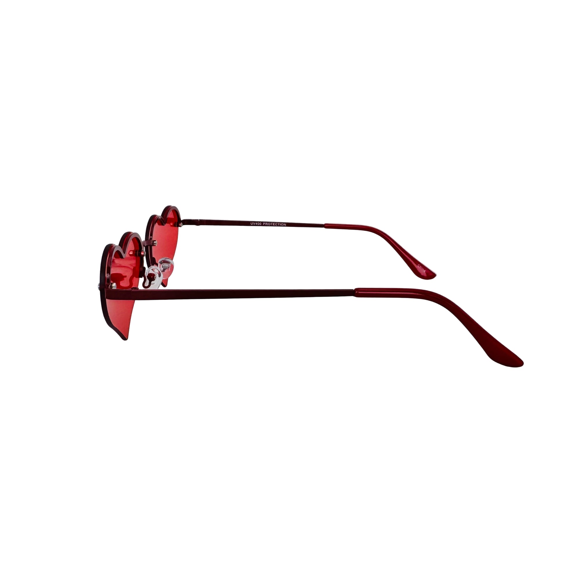 Red sunglasses with heart-shaped lenses on a white background