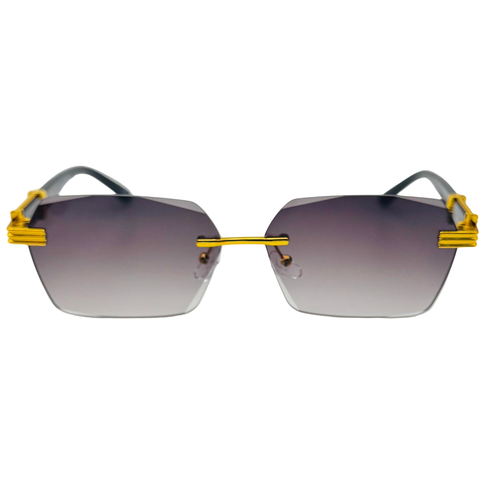 Sunglasses with gold frames and gradient lenses on a light gray background